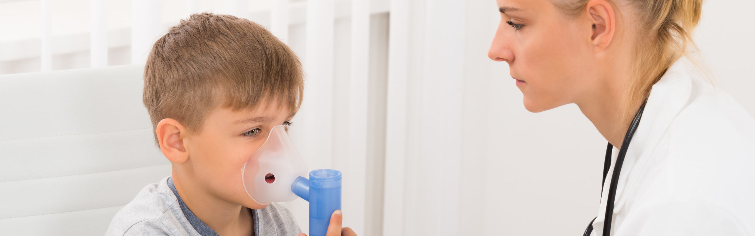 Child Patient Inhaling Through Oxygen Mask
